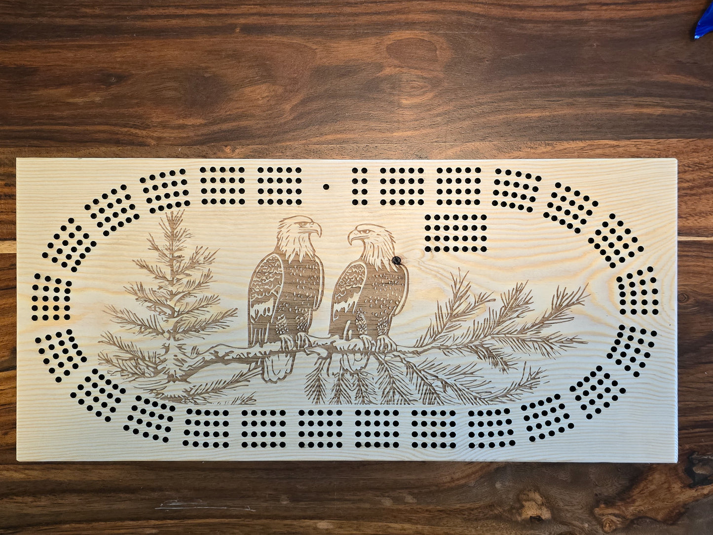 2 Bald Eagles sitting on a branch, 4 track cribbage board