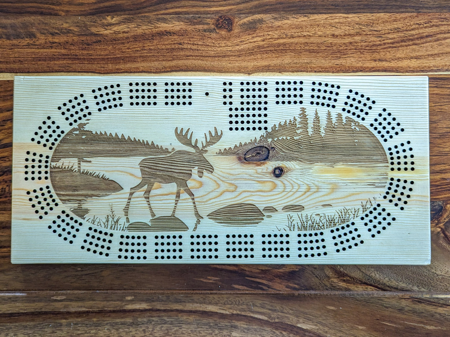 Moose walking in water, 4 Track Cribbage Board