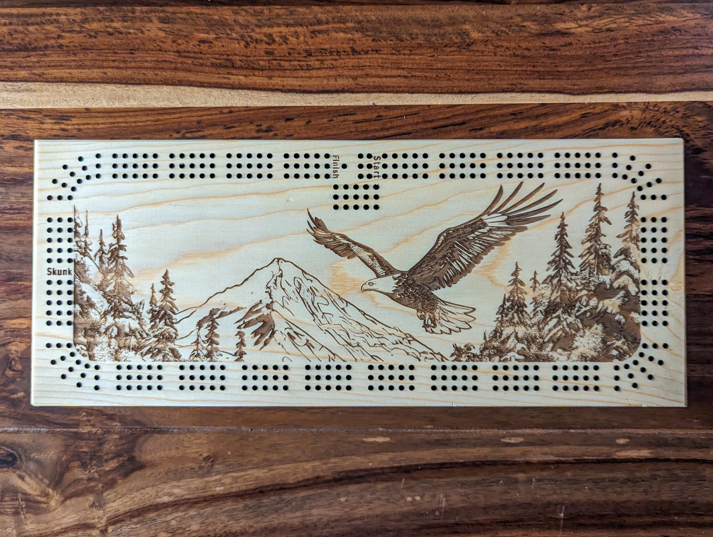 Bald Eagle flying over a valley, 3 Track Cribbage Board - Laser engraved