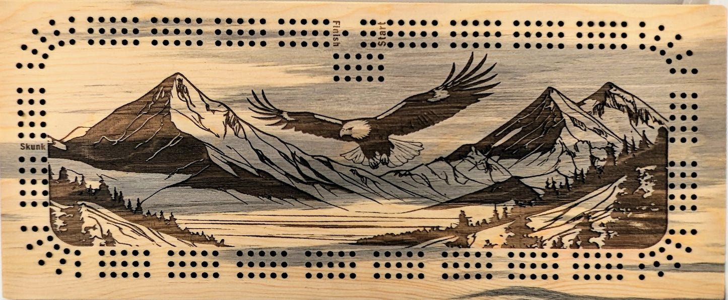 Bald Eagle flying over a valley with mountains, 3 Track Cribbage Board - Laser engraved